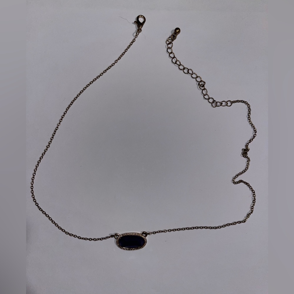 Gold necklace with purple stone